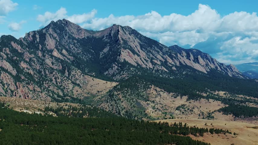 Aerial drone view South Boulder vista of the The Flatirons Colorado summer fall autumn morning sunny blue sky Front Range Rocky Mountains Foothills City of Boulder nature landscape circle right
