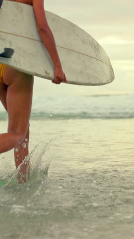 Back, woman and running at beach with surfboard, travel and adventure for summer holiday. Female person, surfer and waves at sea for surfing, getaway journey and water activity for tropical vacation