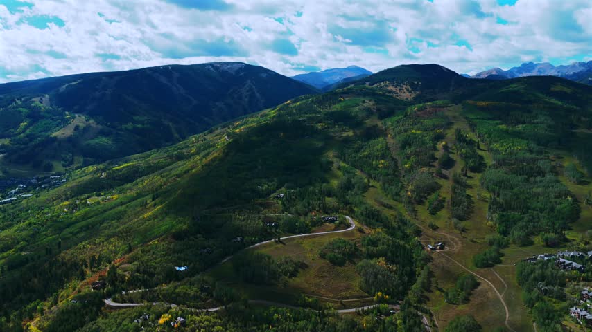 Aerial drone view of Beaver Creek Ski Resort ski trails lift lodge Mt of the Holy Crosssunny blue sky morning Fall Autumn Bachelor Gulch Vail Avon Colorado landscape Ritz Carton buildings pan left