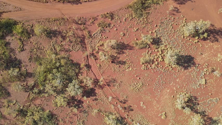 The Pilbara region of Western Australia reveals a vast rugged landscape with expansive terrain, natural colours and remote wilderness
