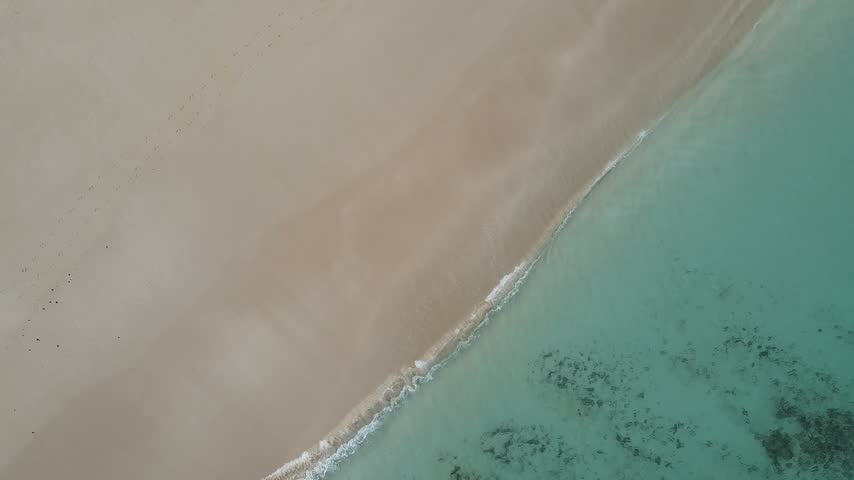 Calm Turquoise Ocean Waves Onto White Sandy Beach At Lucky Bay In Cape Le Grand National Park, Near Esperance, Western Australia. Aerial Shot