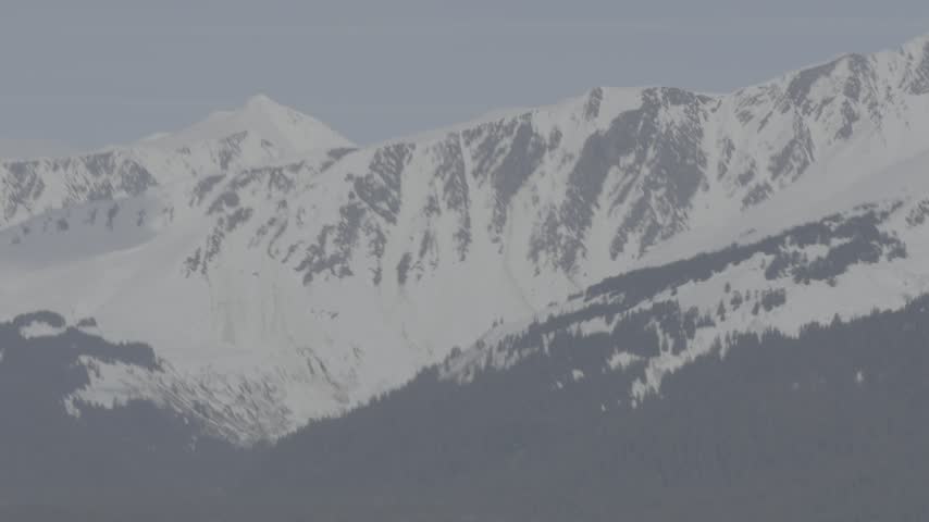 Snow-covered mountain range, Alaska USA
