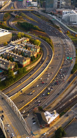 Atlanta transportation infrastructure. Contemporary American city with highway crossing downtown, driving cars and urban architecture.