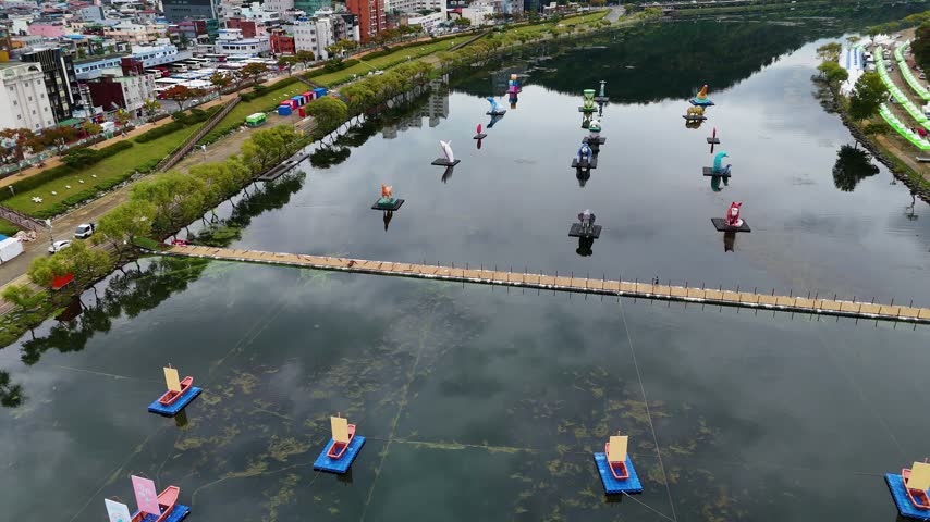 Colorful floating lanterns decorating the calm surface of nam river during jinju namgang yudeung festival in south korea
