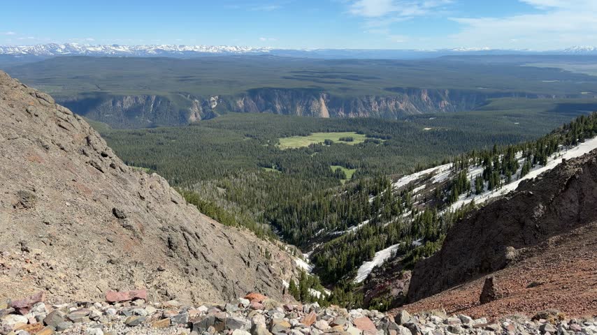 Yellowstone National Park - View of the landscape and prairies from Mount Washburn, Grand Teton in the Background