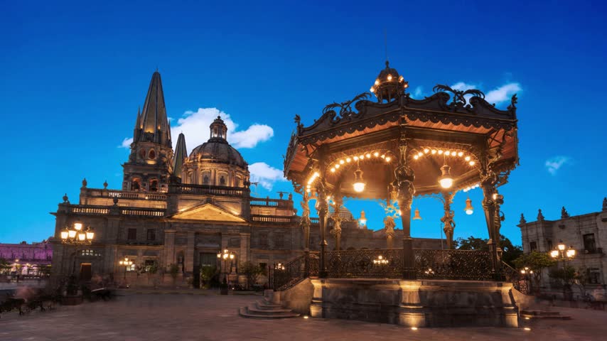 GUADALAJARA, MEXICO  Fountain in front of Main Cathedral. Gudalajara is the capital and largest city of the Mexican state of Jalisco, and the seat of the municipality of GuadalajaraFountain on The Plaza de Armas day to night transition timelapse, also known as the Plaza Mayor, sits at the heart of Lima