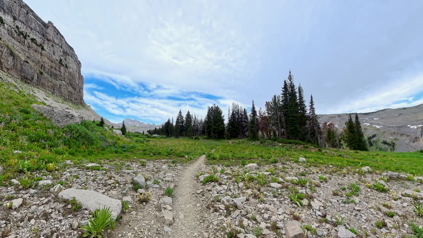 Hiking on Empty Trail Through Field and Forest on Death Canyon Shelf Of Grand Teton National Park 
