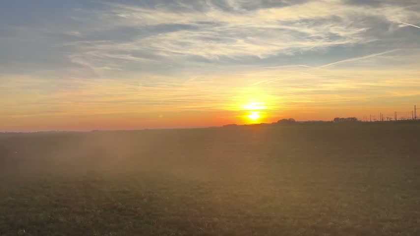 Golden sunset over rural field