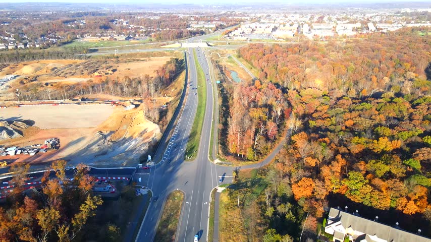Earthworks and a construction site border autumn woodland near Leesburg Virginia.