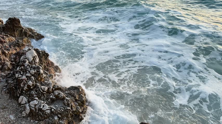 Ocean waves crashing on a rocky coastline