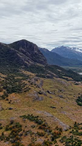 Landscape of Rocky Mountains and Grassy Valleys