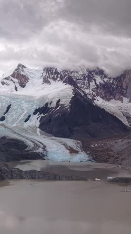 Glacier and Glacial Lake in Mountain Landscape