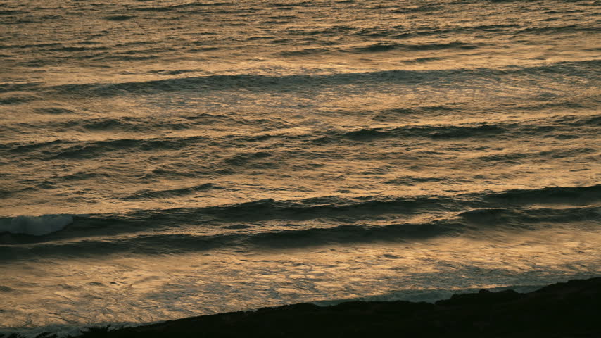 Sunset over the Pacific Ocean on clear cold day 