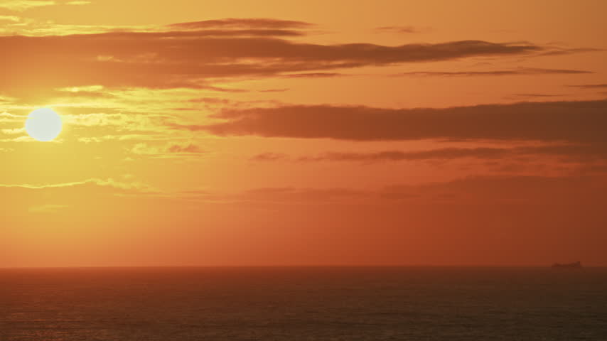 Sunset over the Pacific Ocean on clear cold day 