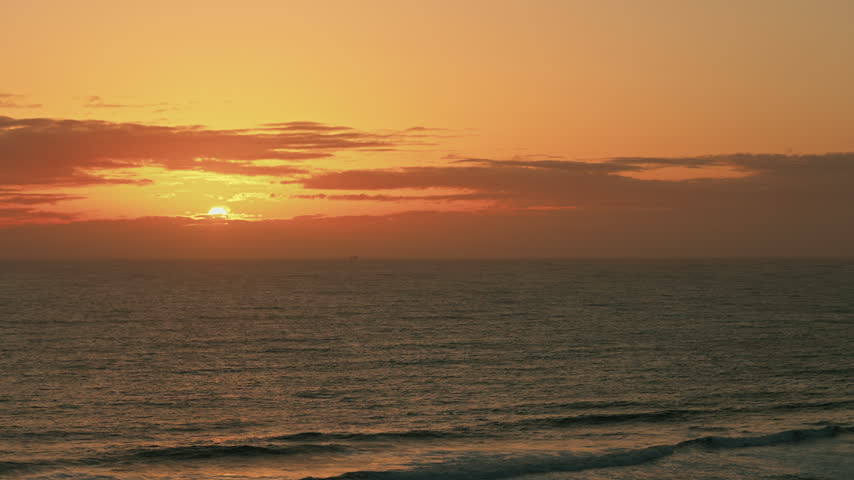 Sunset over the Pacific Ocean on clear cold day 
