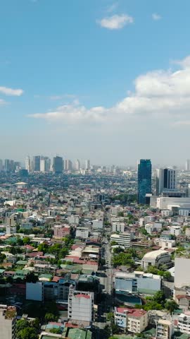 Makati City: Tower residences and commercial buildings. Metro Manila, Philippines. Vertical view.