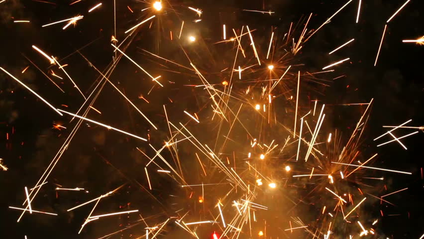 Large firework sparks burning at night fire show