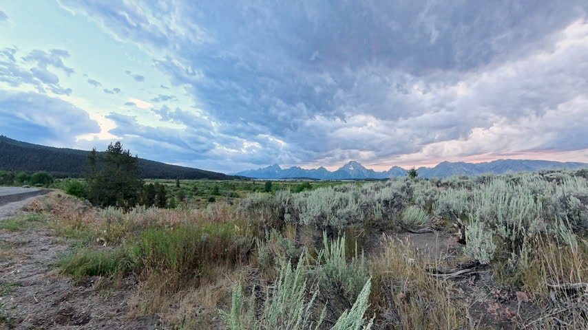 Sunset Through Clouds over Grand Teton National Park 