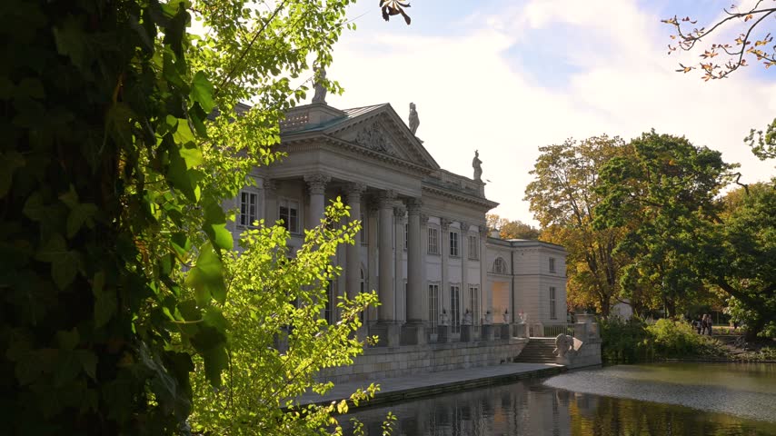 Palace On The Isle (Palace on the Water) Amid Landscaped Gardens And Reflective Ponds In Łazienki Park In Warsaw, Poland. Static Shot