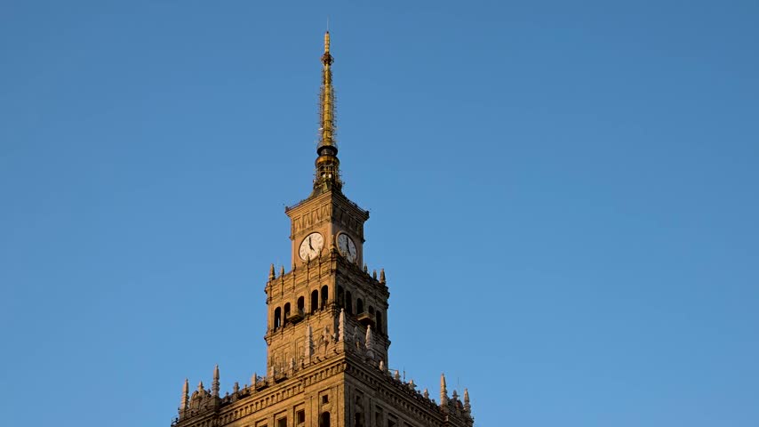 Clock Tower Of The Palace Of Culture And Science In Warsaw, Central Poland. Low-angle Shot