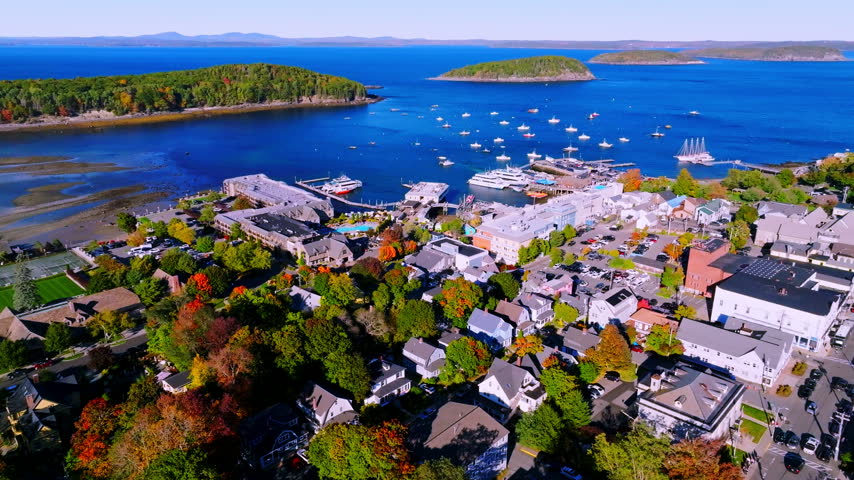 Bar Harbor rooftops and fall maples above the town pier on Frenchman Bay, Maine