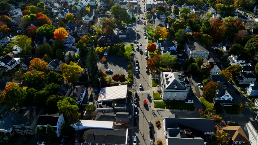 Bar Harbor village street and peak autumn maples below the Acadia mountains, Maine