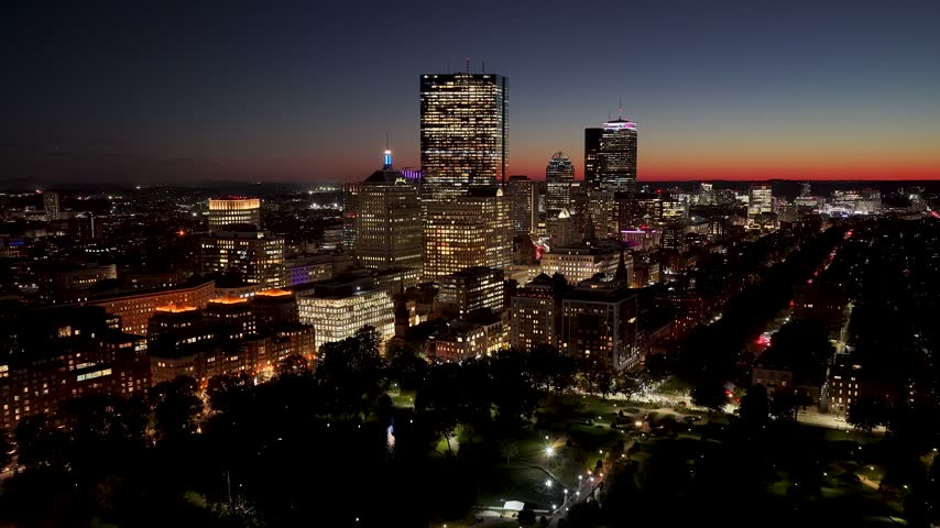 Sunset Over Boston Skyline In Massachusetts United States. Illuminated Cityscape. Downtown District. Highrise Buildings. Boston Skyline In Massachusetts United States. Sunset Skyline.
