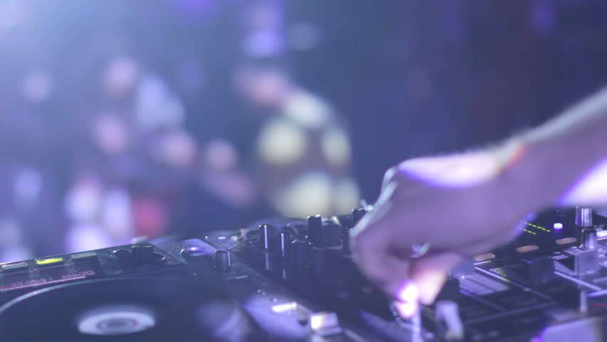 DJ hands control audio equipment people dancing on dancefloor