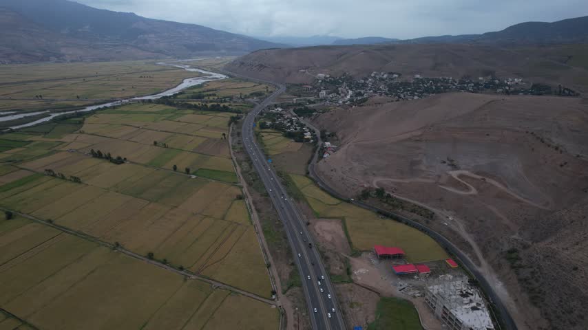 Road and Farmland Across a Broad River Valley