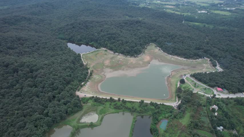 Reservoir with Exposed Shoreline in Green Hills