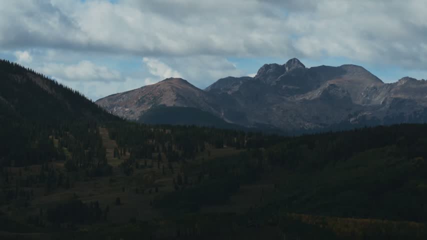 Aerial drone view of Mount of the Holy Cross Beaver Creek Ski Resort ski lift trails sunny blue sky morning Fall Autumn Bachelor Gulch Vail Avon Colorado nature landscape Rocky Mountains static shot