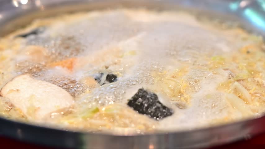 Hot Pot Soup with Sliced Meat, Fish Cake, Shrimp, Noodles, and Seaweed