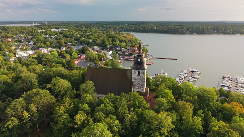 Aerial view of the historic Naantali church in summer, Finland. Stunning twilight scenery of Naantali church and marina