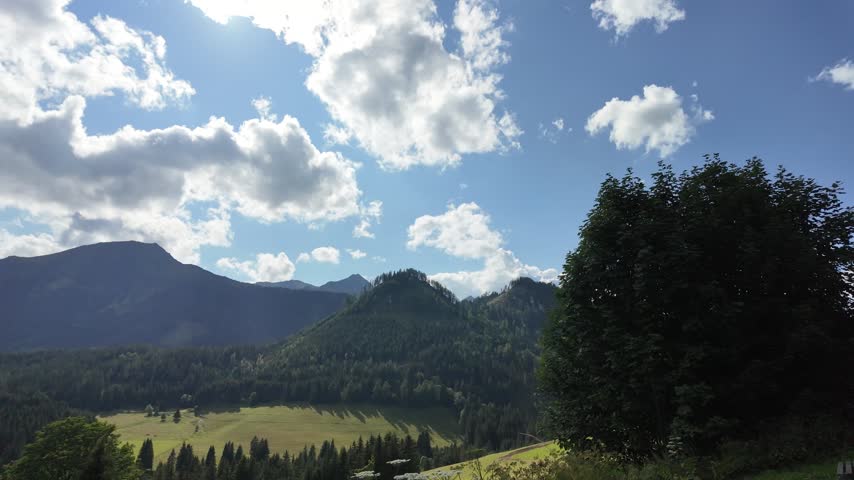 Scenic Mountain Landscape With Green Forest Slopes Valley And Cloudy Sky