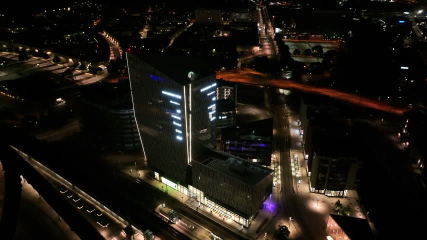 Aerial Night View of Illuminated Modern Skyscraper and City Lights in Gothenburg, Sweden
