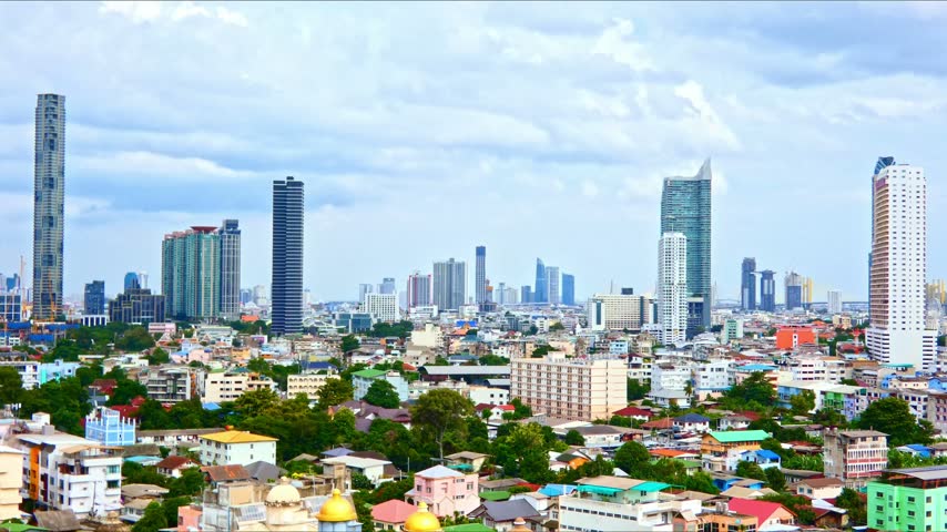 Bangkok City Skyline with Modern Skyscraper and Colorful Neighborhood Under Cloudy Sky