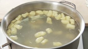 Gnocchi being cooked in salt water