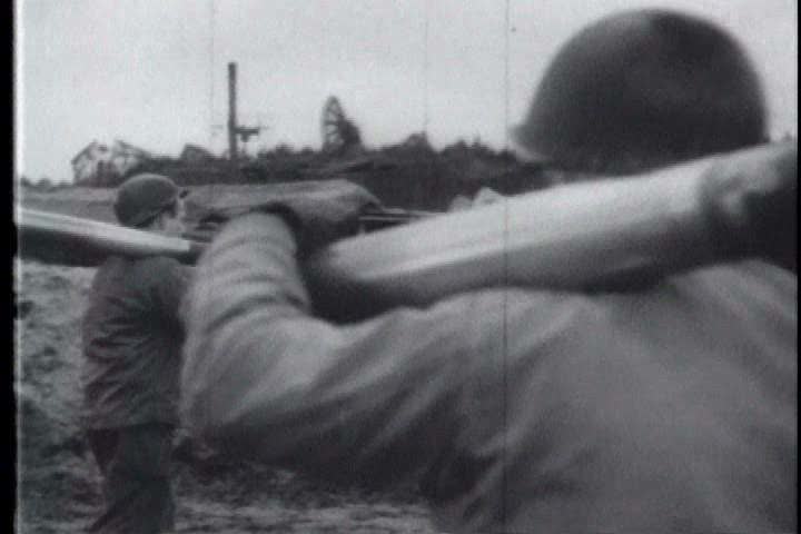 1950s - Allied forces use anti-aircraft artillery to protect Antwerp, Belgium from a Nazi air-raid during World War 2