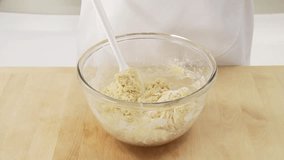 Ingredients for yeast dough being mixed and kneaded
