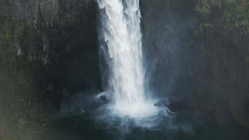Waterfall meets the surface of the river.