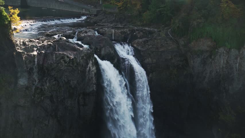 Panning down shot of Snoqualmie Falls, Washington State in the autumn.