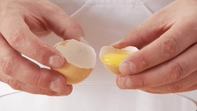 Egg yolk being poured into a bowl