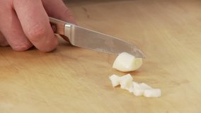 Garlic being chopped