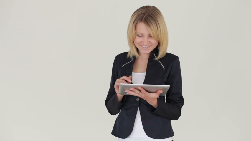 Businesswoman standing with tablet pc
