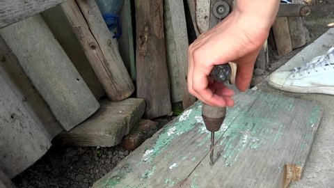 person working with old hand tools