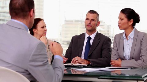 Business people listening to a job applicant during a job interview