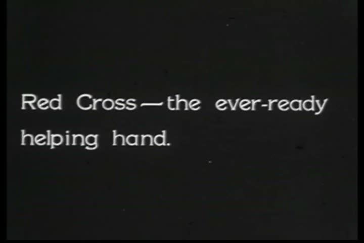 1920s - The red cross lends aid to the citizens of a town destroyed by flooding during the 1920s