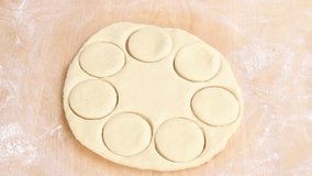 Circles being cut out of pastry