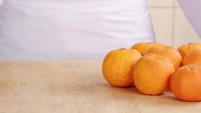 Peeling Seville oranges using a peeler