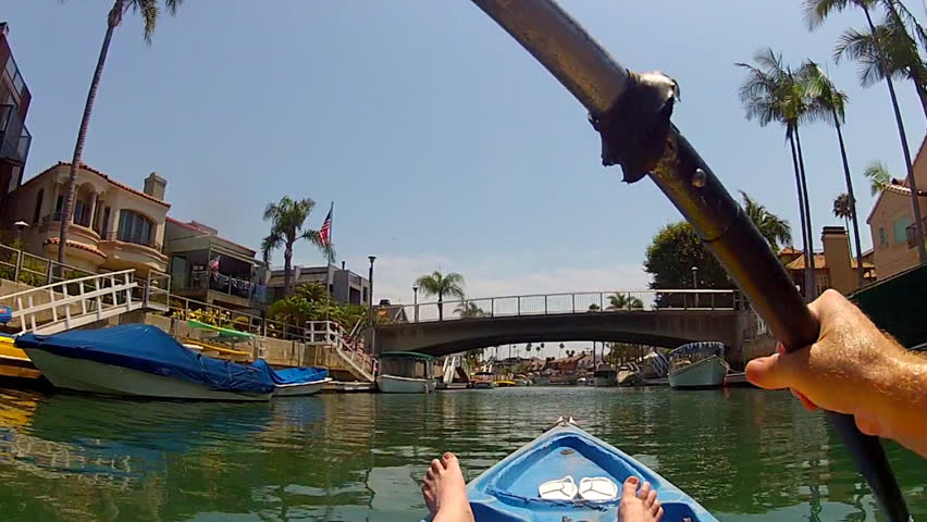 The point of view of someone paddling a kayak in the Naples Island canals which